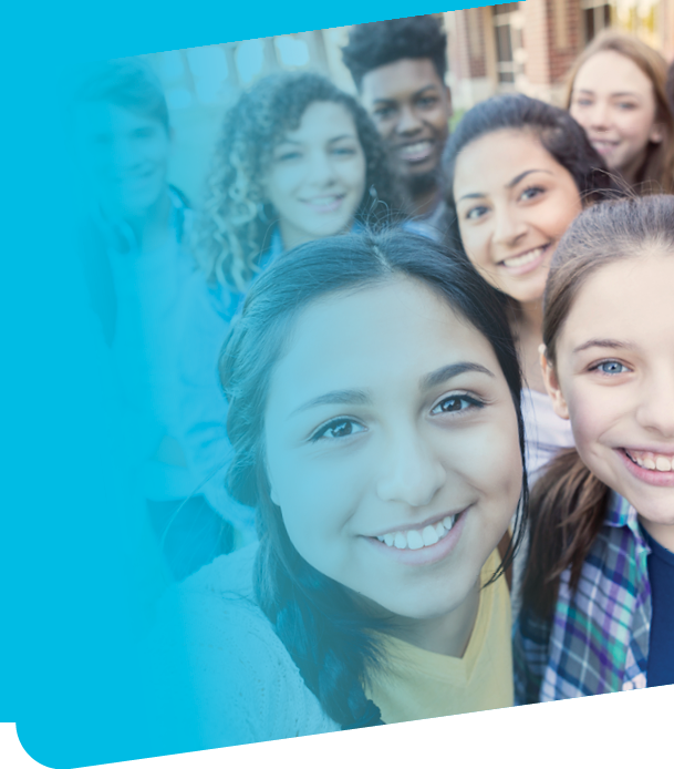Diverse group of eight high school students are smiling and looking at the camera  Teenagers are students at public high school, and are wearing backpacks or holding school books 