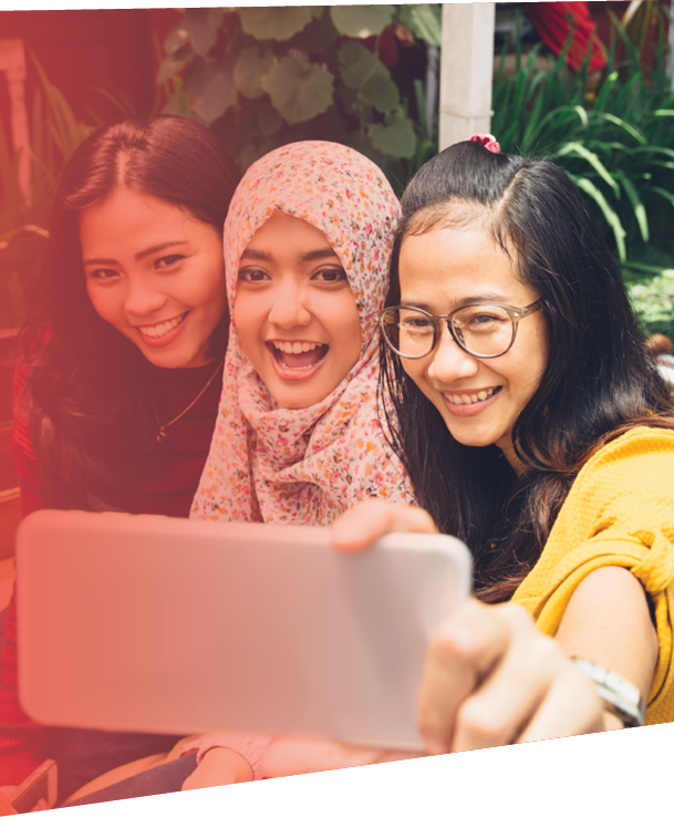 portrait of happy young girl friend taking selfie together in cafe