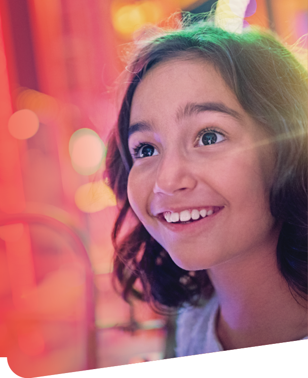 Happy girl is smiling on ferris wheel in an amusement park